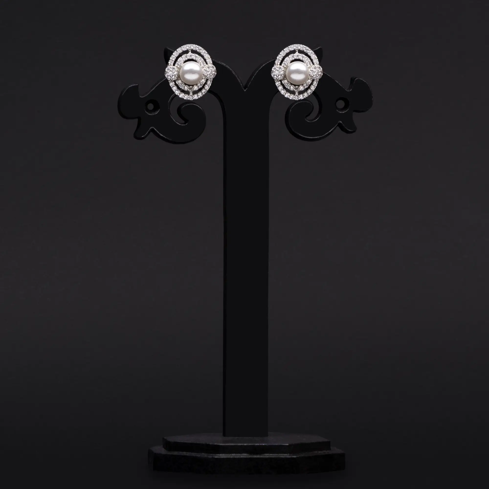 Rhodium-Plated Pearl Tops Adorned with American Diamond Earrings in Two Swirls