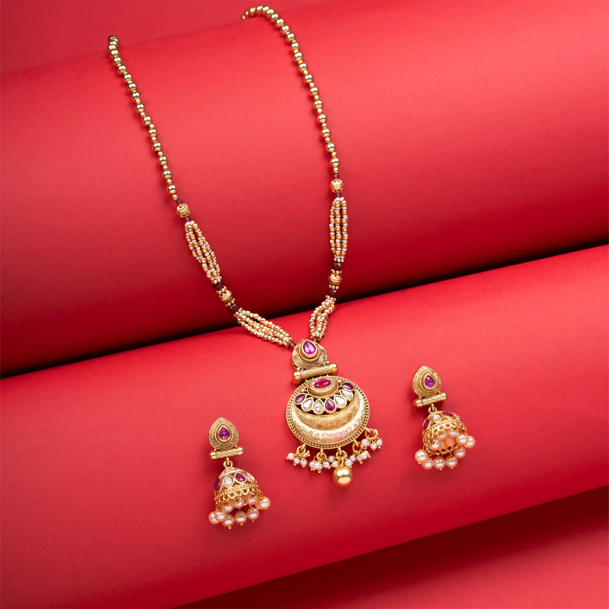 Antique Gold-Plated Pendant Set of Kundan and White Pearls with Jhumkas