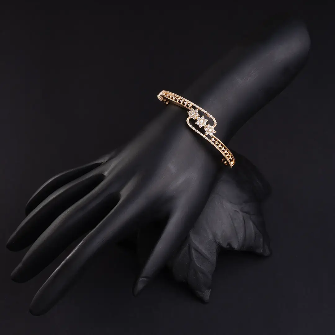Floral Design adorned with American Diamond in Carrot Gold-Plating Bracelet