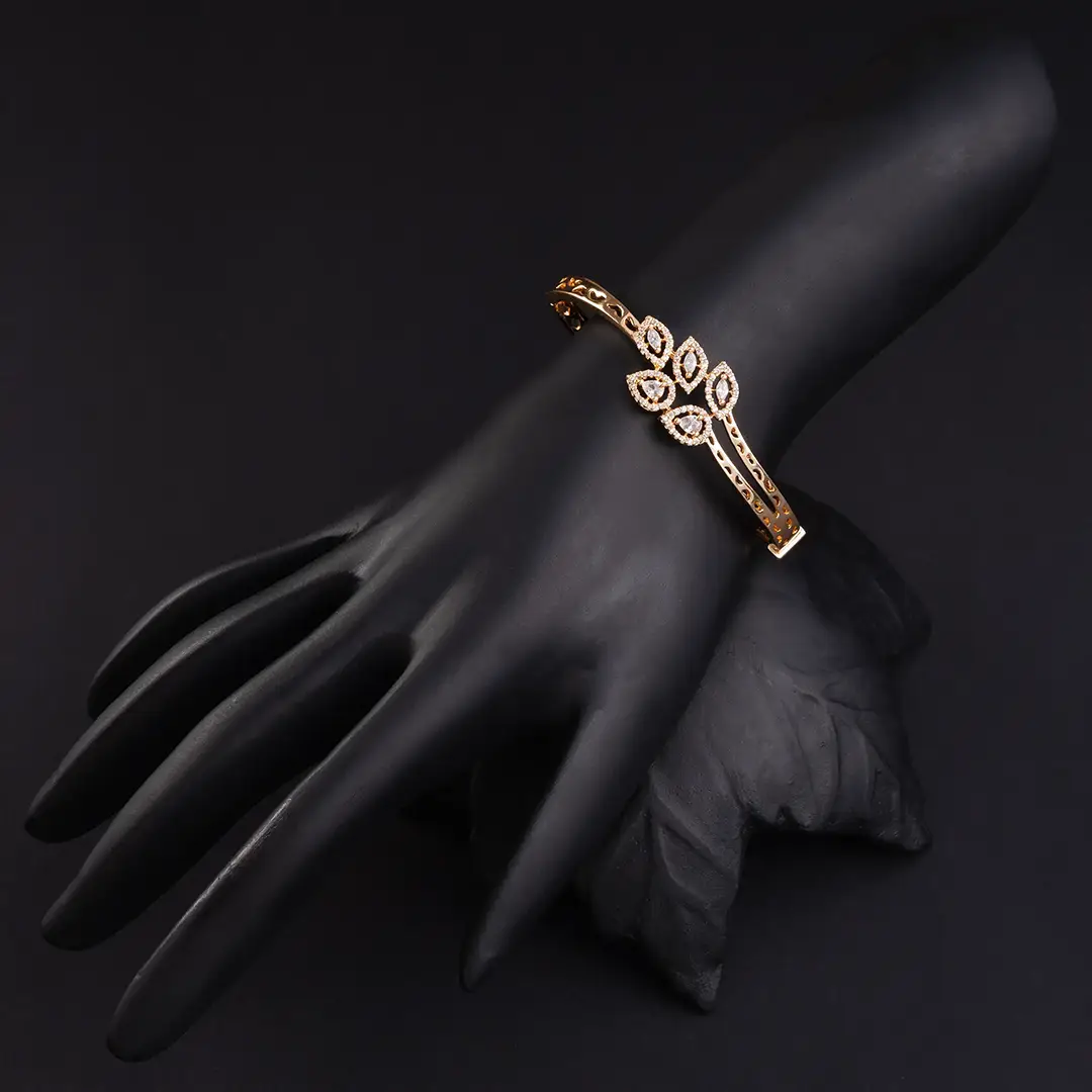 Leaf Shaped Design adorned with American Diamond in Carrot Gold-Plating Bracelet