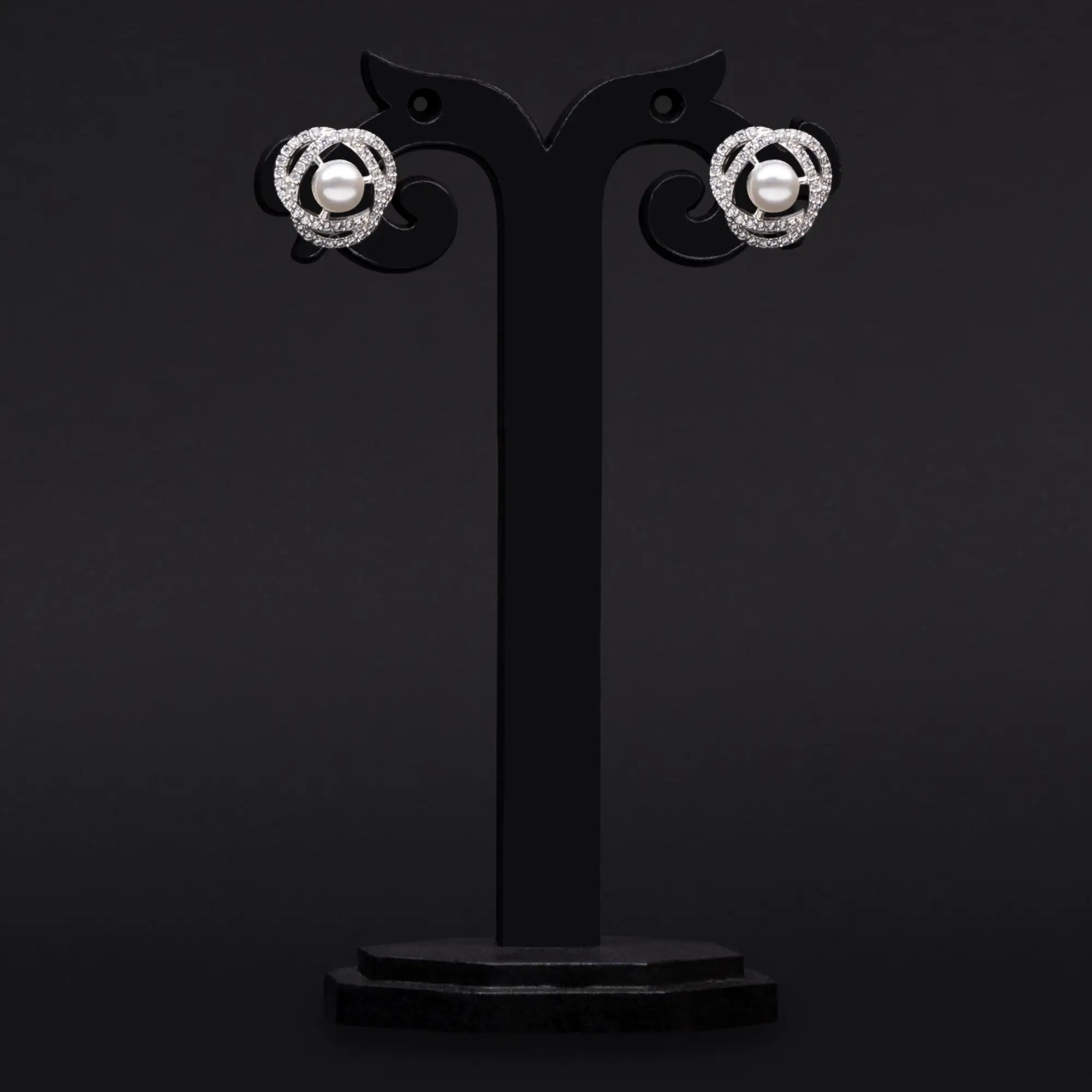 Rhodium Plated Pearl Tops Adorned with American Diamonds Earrings in Two Swirls